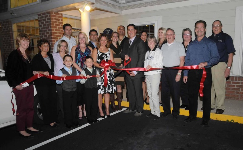 Dr. Scott Michael Schulze and his staff cut the ribbon at his new office in a Oct. 23 ceremony sponsored by the Lewes Chamber of Commerce. Shown at the ribbon cutting standing in back are (l-r) Dr. Rob Myers; Jack Berberian, owner SecurNet MD; Lisa McDonald, chamber director; Dr. Fadi Damouni; Nikky Fisher, chamber director; Jen Joseph, chamber president; Kathy Davidson, chamber vice president; Orville Mills, chamber director. In front are Betsy Reamer, chamber executive director; Carole Lea Whalen, administrative staff for Dr. Schulze; Keri Schaeffer, clinical director Old Towne Physical Therapy; Scottie Michael Schulze; Erica Hite, medical assistant; David Joseph Schulze; Julie Schulze; Dr. Scott Michael Schulze; Bonnie Osler, Lewes city councilwoman; Fred Beaufait, Lewes city councilman; and Lewes Mayor Jim Ford. BY STEVEN BILLUPS